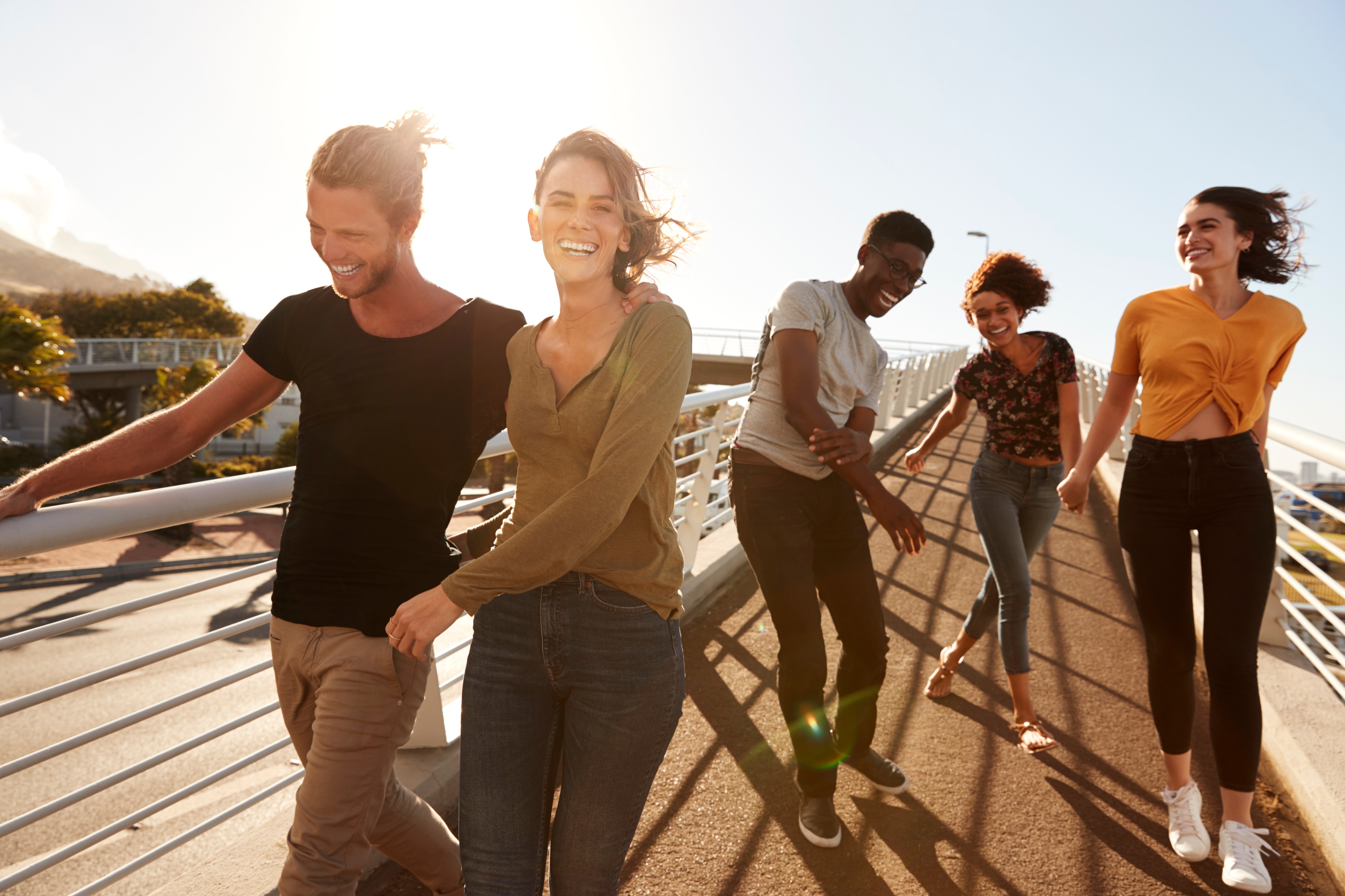 friends walking on pier